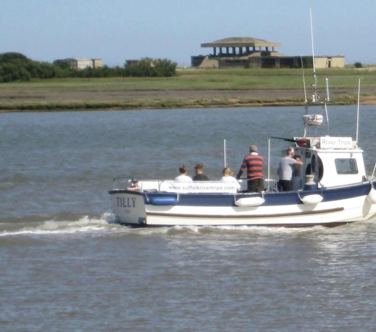 Tilly, the Suffolk River Trips boat, heading out on the River Alde on a clear day