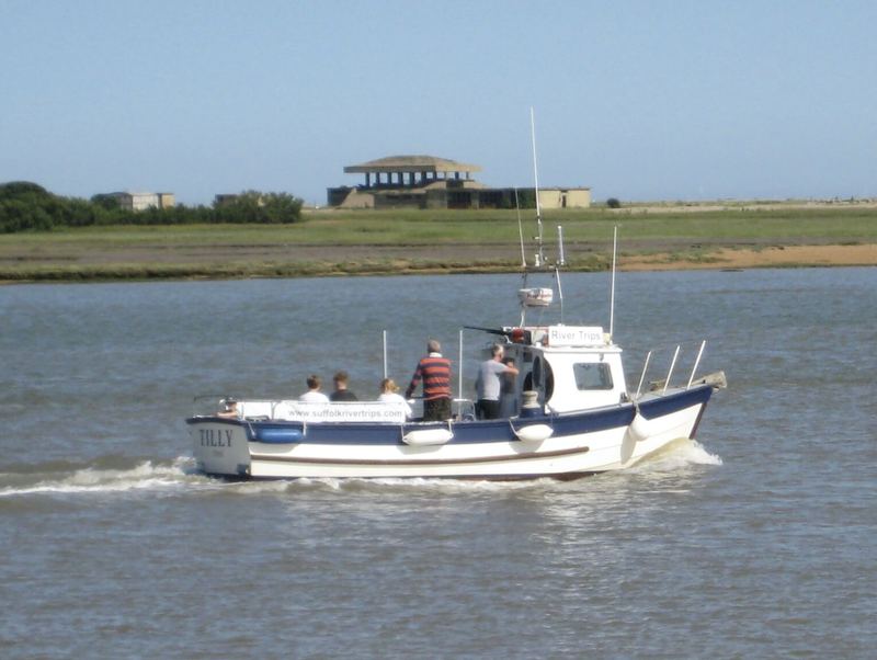 Tilly, the Suffolk River Trips boat, heading out from Orford Quay on the River Alde